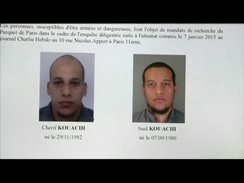 Charlie Hebdo shooting: one suspect turns himself in, two still at large