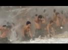 Shirtless South Korean soldiers brave bitter cold in military drill