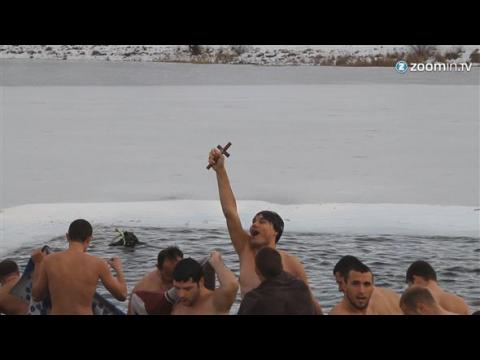 Bulgarian men celebrate Epiphany with icy dive