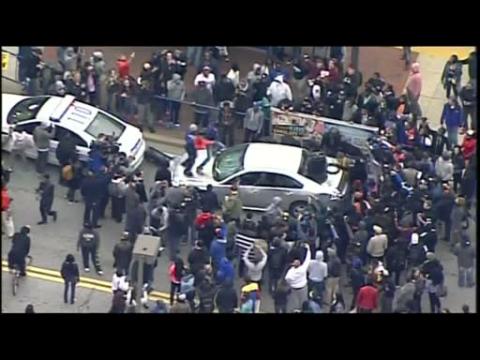 Protesters smash cars, face-off with Baltimore police