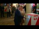 Presidential hopefuls in Poland cast votes in race too close to call