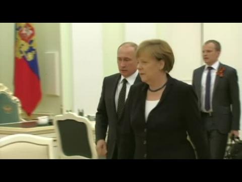 Putin says Ukraine peace process progressing, Merkel wants Putin to use influence on rebels