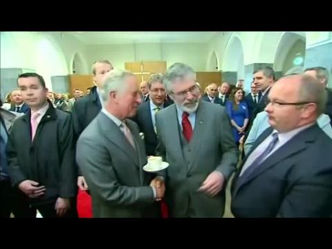 Prince Charles shakes hands with Sinn Fein leader Gerry Adams