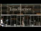Time Warner posts strong sales, but profit drops
