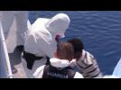 Hundreds of migrants are rescued from an overcrowded dinghy