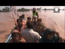Hundreds die as parts of India and Pakistan are hit by floods.