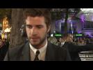 Liam Hemsworth Gets His Hair Wet At "The Hunger Games" Premiere