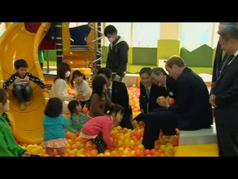 Prince William juggles balls and plants tree at Fukushima play school