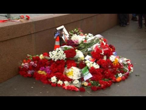 Russian mourners lay flowers at the spot where opposition leader was killed