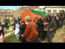 Afghans bury woman killed in mob attack