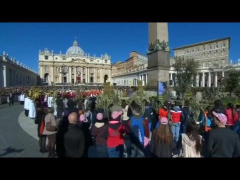 Thousands wave palm and olive branches in St. Peter's Square