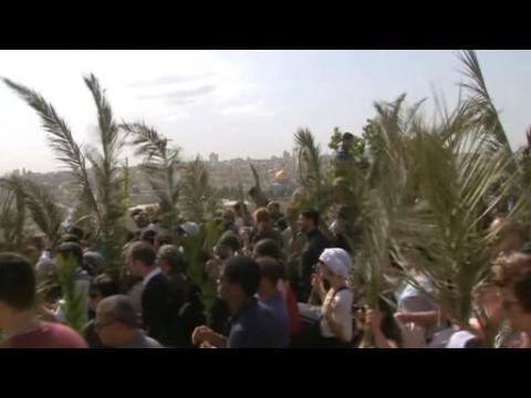 Faithful attend Palm Sunday processions in the Holy Land