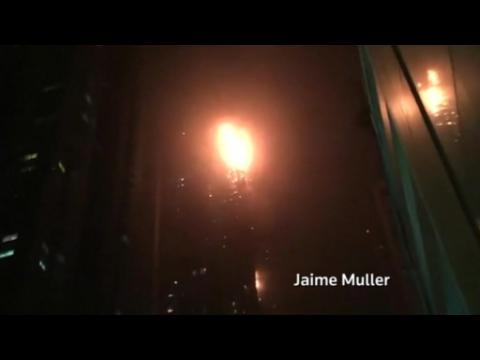 Fire engulfs one of world's tallest apartment buildings