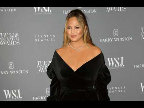 Chrissy Teigen '20 pounds heavier' since having son Miles