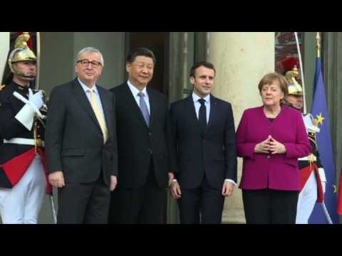 Macron, Merkel and Juncker greet Xi Jinping at Élysée Palace