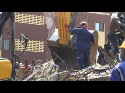 Emergency workers on scene of Lagos building collapse