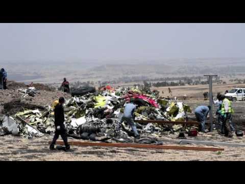Workers clean debris at Ethiopia plane crash site