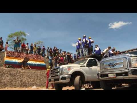 Humanitarian aid trucks wait on the Brasil-Venezuela border