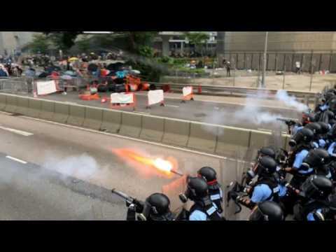 Police charge and fire tear gas at protesters in Hong Kong
