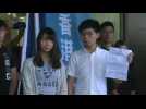Hong Kong activist Joshua Wong leaves court after arrest