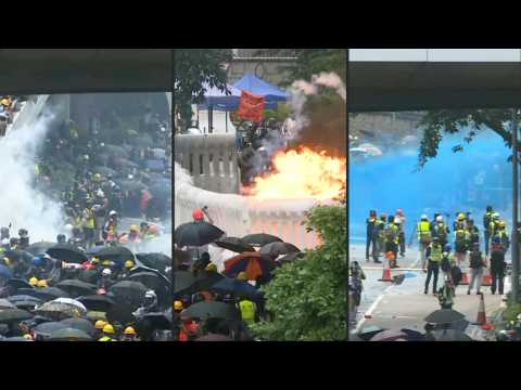 Tear gas and water cannon as Hong Kong police clash with protesters