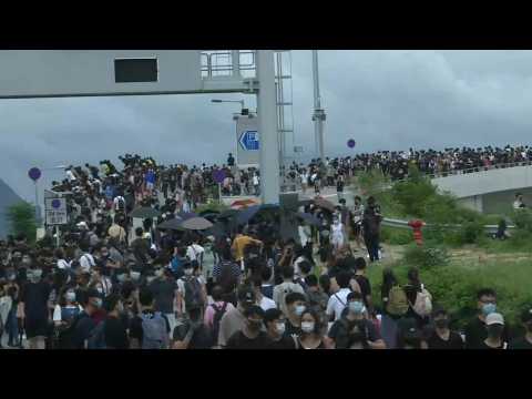 Hong Kong protesters march along roads near airport
