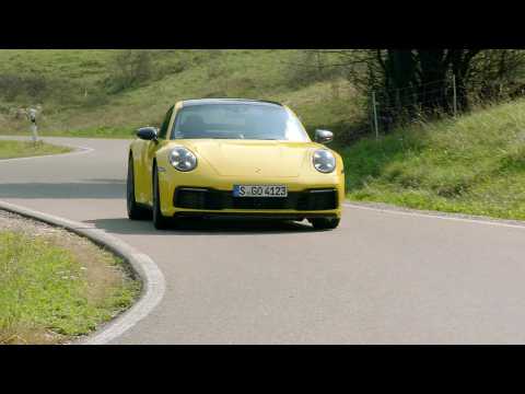 The new Porsche 911 Coupé in Racing Yellow Driving Video