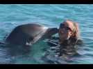 Mariah Carey swims with dolphins