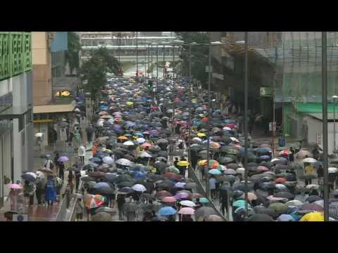 Hong Kong protesters march in fresh rally after night of clashes