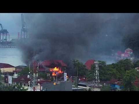 Rioters torch government building in Indonesia's Papua