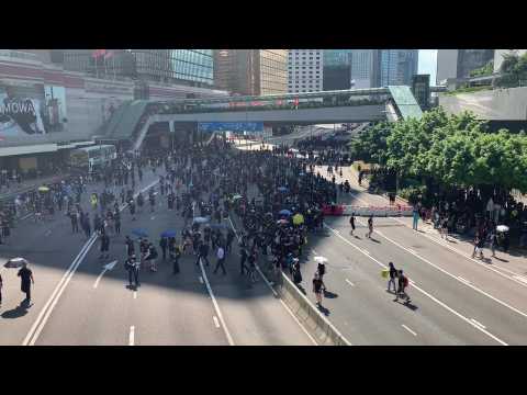 Protesters block road near key HK government offices