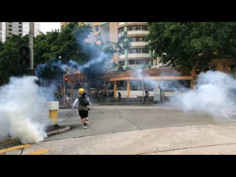 Hong Kong police fire tear gas in working-class district