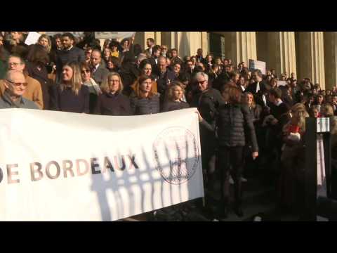 Lawyers protesting pension reform throw their robes onto courthouse steps