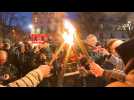 French union holds torch-lit protest in Paris against pension reform