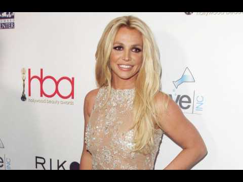 Britney Spears might get double dice tattoo removed