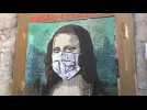 Urban Artist Tvboy painst mask-wearing Mona Lisa in Barcelona