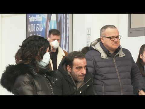 Italy: residents queue for supplies at supermarket after coronavirus outbreak