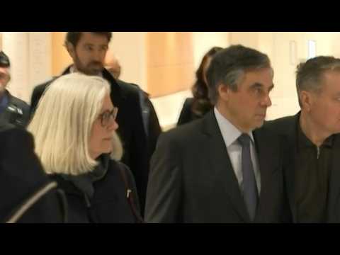Former French PM arrives in court with wife Penelope at start of fraud trial
