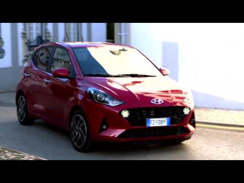 The new Hyundai i10 in Dragon Red Driving in the city