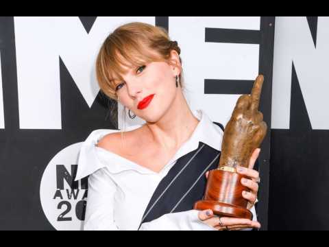 Taylor Swift makes surprise appearance to accept NME Award