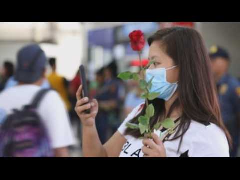 Police in Manila celebrate Valentine's Day with live performances