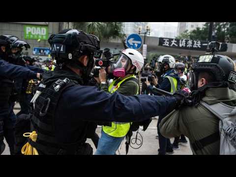 Rally cut short in Hong Kong as police confront protesters