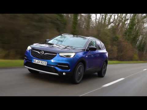 The new Opel Grandland X Hybrid 4 in Blue Driving Video