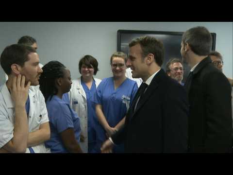 French president visits hospital where first French coronavirus victim died