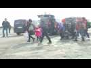 Migrants rush to get buses in Istanbul heading for Greek border