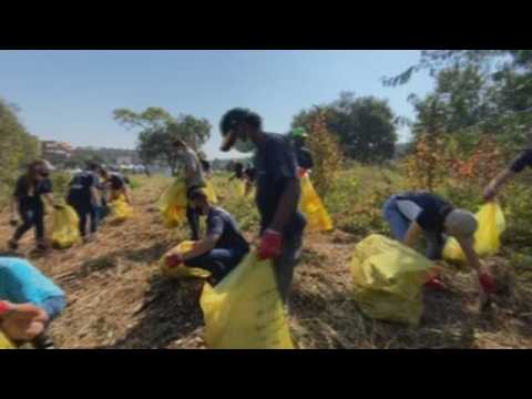 Volunteers clean South Africa's Hennops river on Earth Day