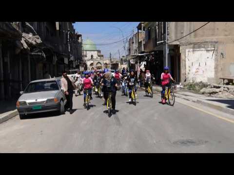 Iraqi female cyclers rally to promote bike-riding in Mosul