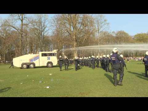 Riot police break up large crowds gathered in Brussels park for fake concert