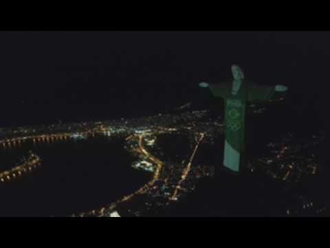Christ the Redeemer turns green and yellow to celebrate the remainding 100 days before Tokyo 2020
