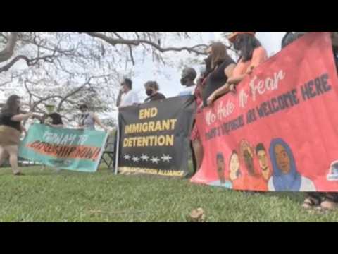 Activists protest outside of a jail for migrants in Florida